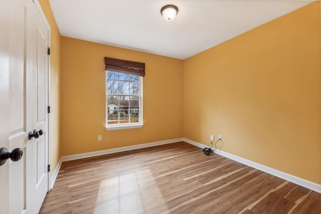 spare room with light hardwood / wood-style floors