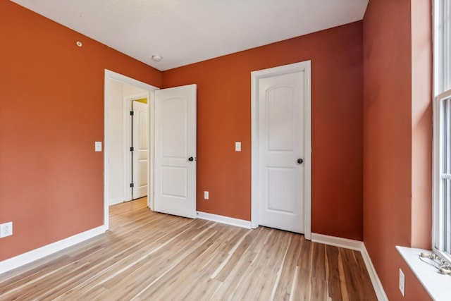 unfurnished bedroom with light hardwood / wood-style flooring