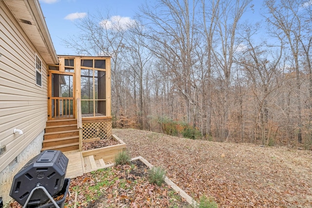 view of yard featuring a sunroom