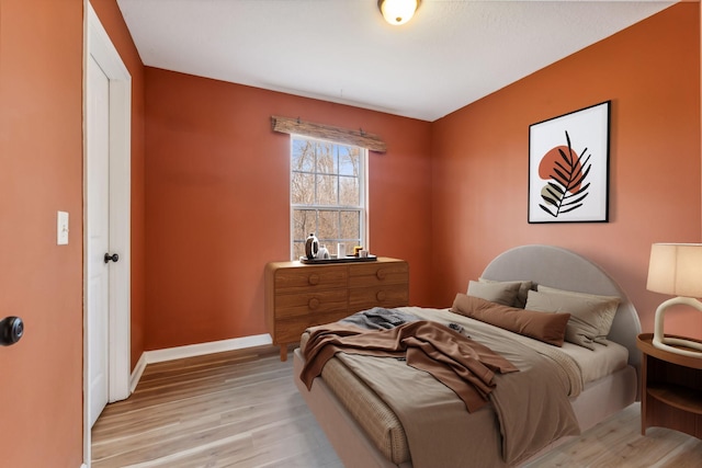 bedroom with light wood-type flooring