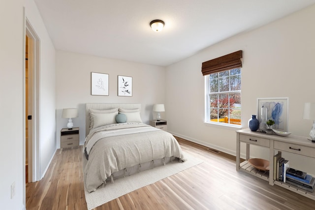 bedroom featuring light hardwood / wood-style floors