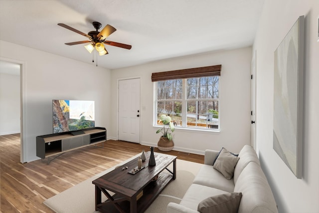 living room with hardwood / wood-style floors and ceiling fan