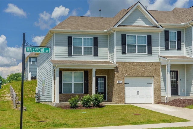 view of front facade featuring a garage and a front lawn