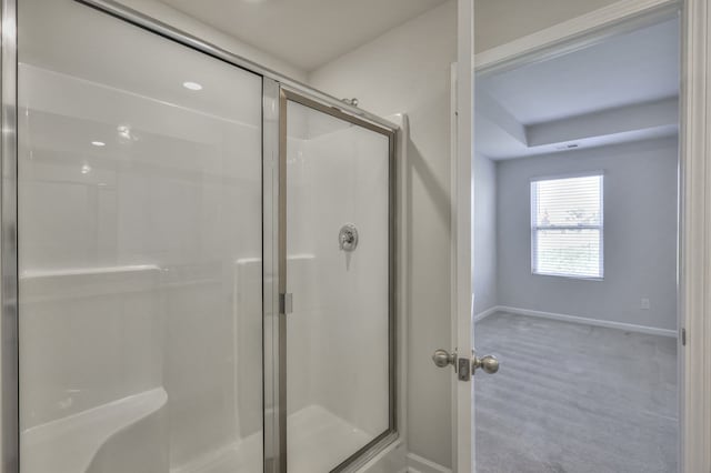 bathroom with a shower with shower door