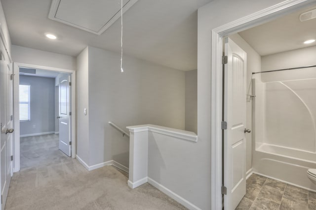 hallway featuring light carpet