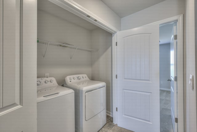 washroom featuring washing machine and dryer and light colored carpet