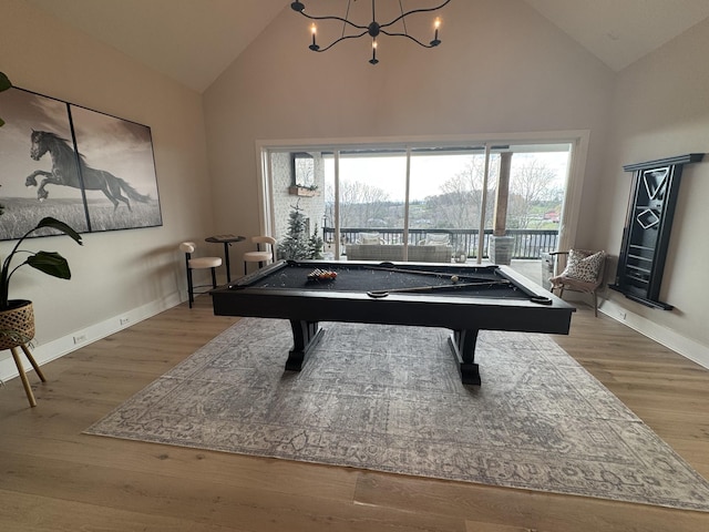 recreation room with high vaulted ceiling, light hardwood / wood-style flooring, and plenty of natural light