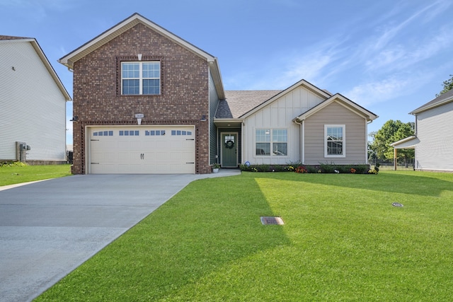 view of front of property with a front yard and a garage