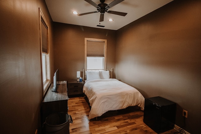 bedroom featuring ceiling fan and light hardwood / wood-style floors