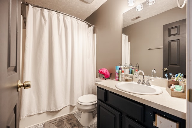 full bathroom with vanity, tile patterned floors, toilet, shower / bathtub combination with curtain, and a textured ceiling