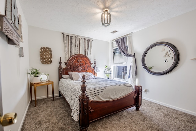 carpeted bedroom featuring a textured ceiling