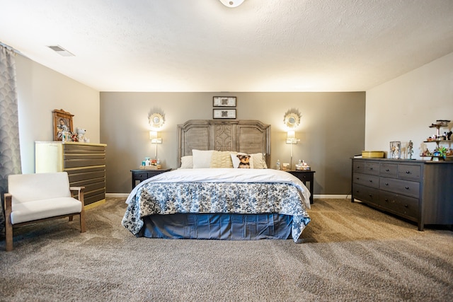 bedroom with carpet and a textured ceiling