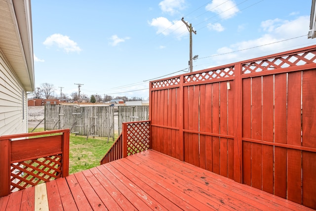 wooden deck with a lawn