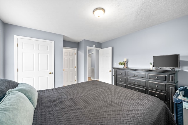 bedroom featuring a textured ceiling