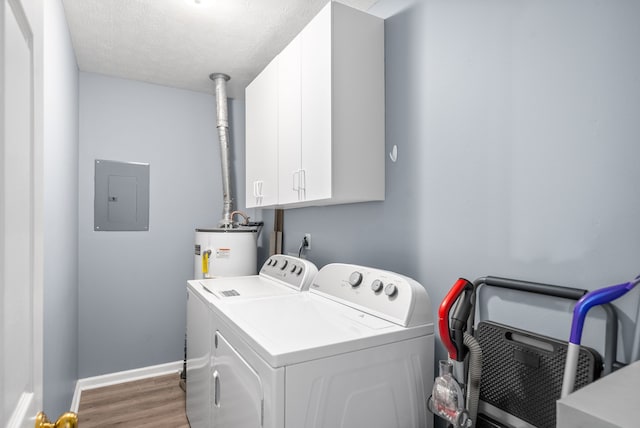 laundry area featuring cabinets, water heater, separate washer and dryer, hardwood / wood-style floors, and electric panel