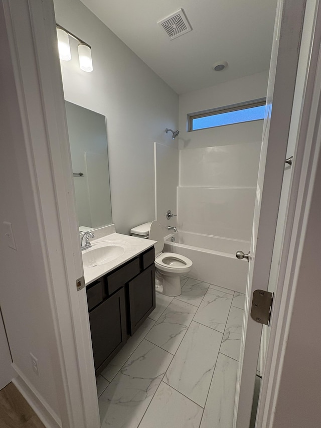 full bathroom featuring shower / tub combination, vanity, and toilet