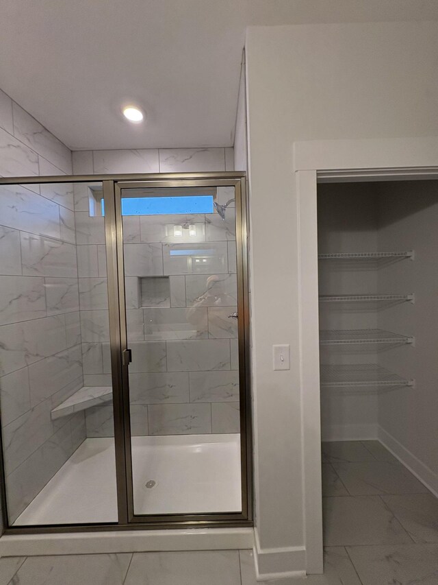 bathroom with an enclosed shower