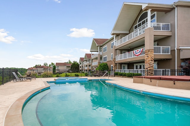 view of swimming pool with a patio