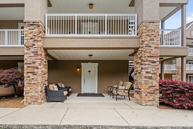 doorway to property featuring a patio