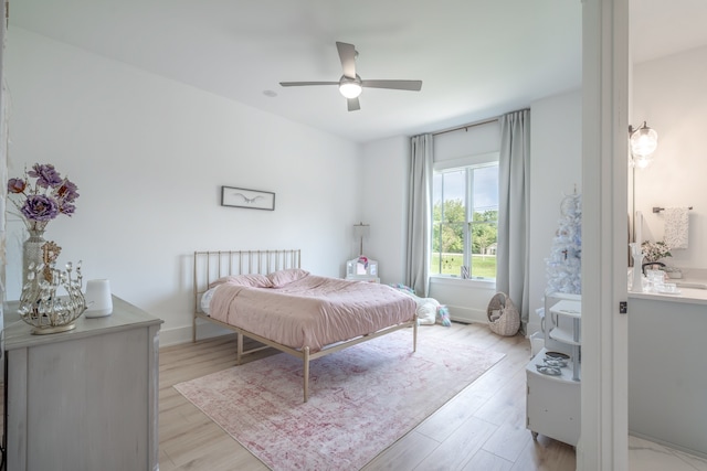 bedroom featuring ceiling fan and light hardwood / wood-style flooring