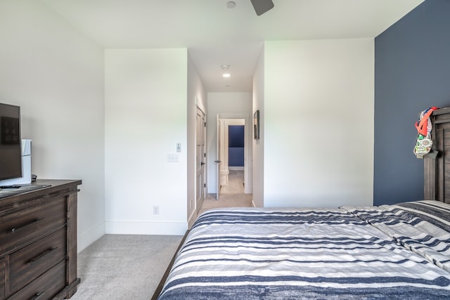 bedroom with light carpet and ceiling fan