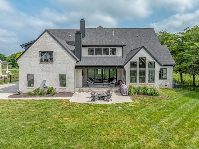 back of house featuring a yard, a patio, and central AC