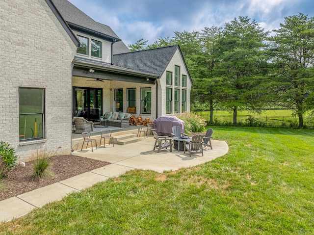 exterior space with ceiling fan and an outdoor hangout area