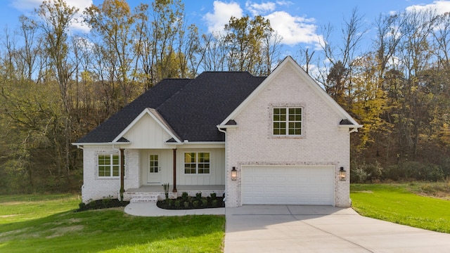 view of front of property featuring a front yard and a garage