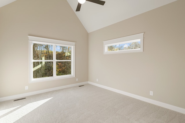 empty room featuring carpet flooring, high vaulted ceiling, and ceiling fan