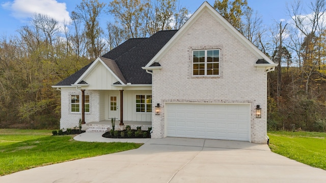 view of front of house featuring a front yard and a garage