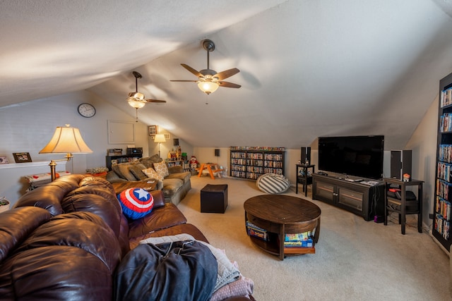 living room with ceiling fan, carpet, and lofted ceiling