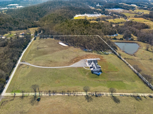 aerial view with a water view and a rural view