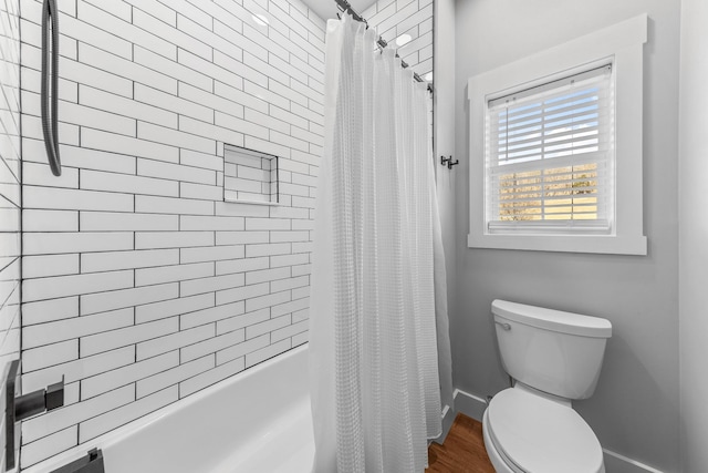 bathroom featuring toilet and shower / bath combo