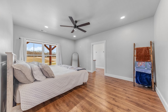 bedroom with ceiling fan and hardwood / wood-style floors