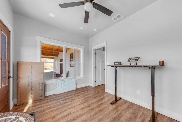 interior space with light hardwood / wood-style floors and ceiling fan