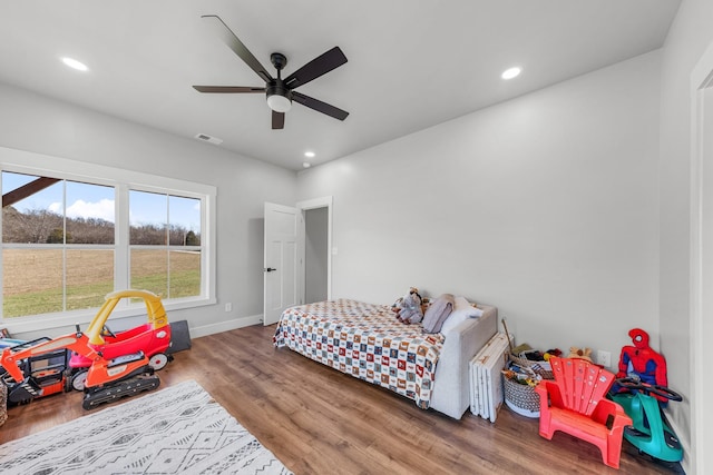 bedroom featuring ceiling fan and hardwood / wood-style floors