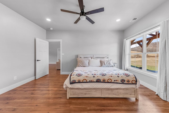 bedroom featuring ceiling fan and wood-type flooring