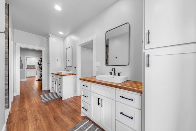 bathroom featuring hardwood / wood-style flooring and vanity