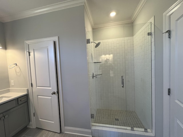 bathroom featuring vanity, ornamental molding, and walk in shower