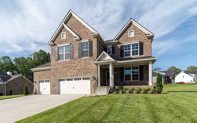 7329 Buckhorn Ct, Fairview, TN 37062 - craftsman house with brick siding, driveway, a front yard, an attached garage, and covered porch
