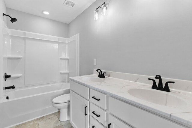 full bathroom with shower / tub combination, vanity, toilet, and tile patterned floors