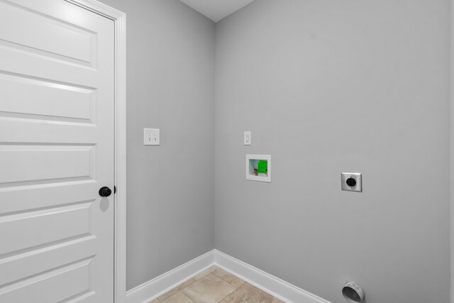 laundry room featuring hookup for an electric dryer, light tile patterned floors, and hookup for a washing machine