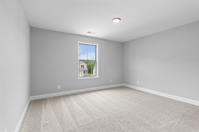 empty room with carpet flooring