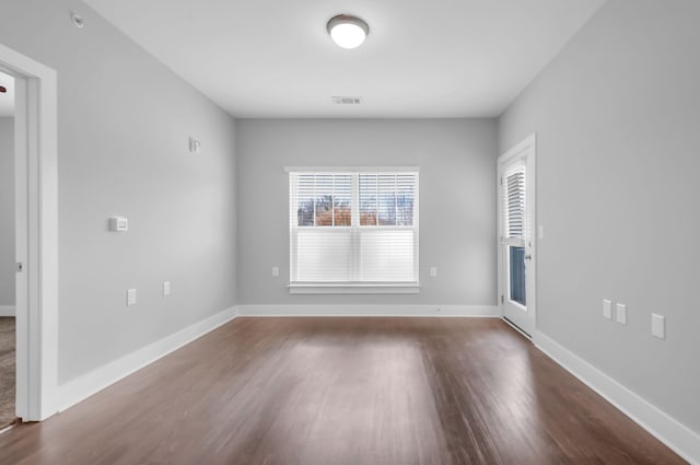 unfurnished room featuring hardwood / wood-style flooring