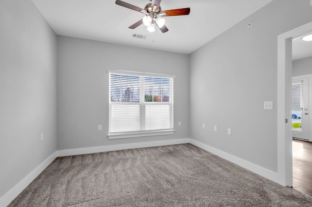 empty room featuring carpet and ceiling fan