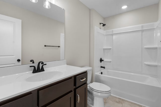 full bathroom featuring bathtub / shower combination, vanity, tile patterned floors, and toilet