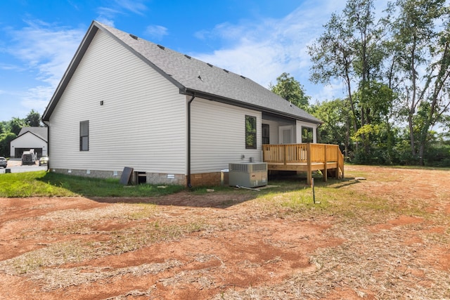 view of home's exterior with a deck and central AC unit