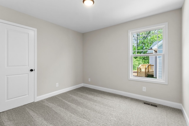 unfurnished room with carpet