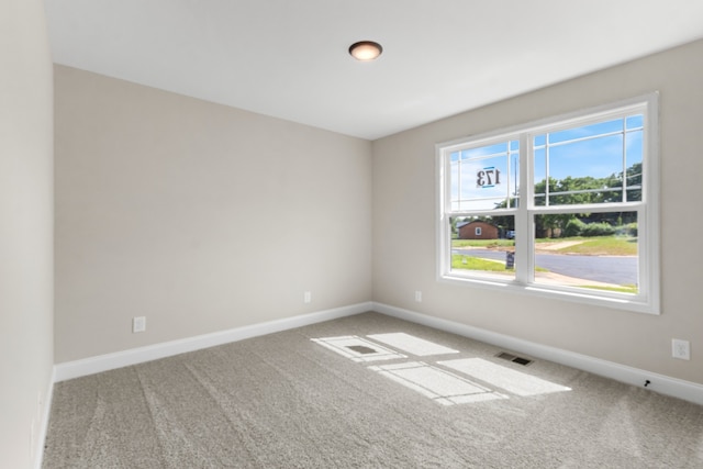 empty room featuring carpet floors