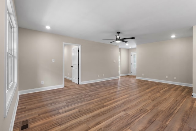 unfurnished room featuring hardwood / wood-style flooring and ceiling fan